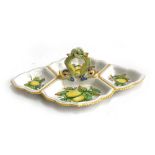 An Italian Majolica Cantagalli Firenze hors d'oeuvre dish, twin dolphin handle, painted with lemons,