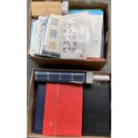 An accumulation of world stamps including two printed Great Britain albums, a number of stock