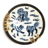 A Chinese crackle glaze plate depicting three foo dogs amongst rui clouds, character marks to