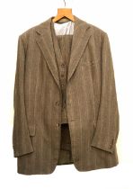 A Denman & Goddard three piece brown tweed suit c.1975, the trousers with button fly and brace