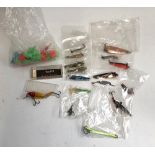 A number of Toby style lures; a Muddler Minnow; a vintage Mirrolure; and a number of treble guards