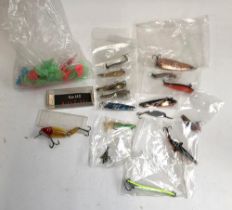 A number of Toby style lures; a Muddler Minnow; a vintage Mirrolure; and a number of treble guards