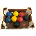 A set of four cross hatched croquet balls; together with a further set of smooth balls