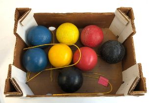 A set of four cross hatched croquet balls; together with a further set of smooth balls