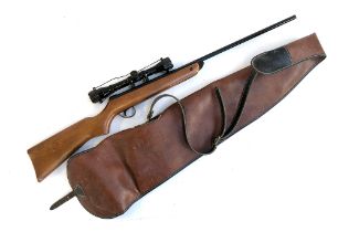 A BSA Meteor break action air rifle with Nikko Stirling Mountmaster 4x32 sight and gun slip