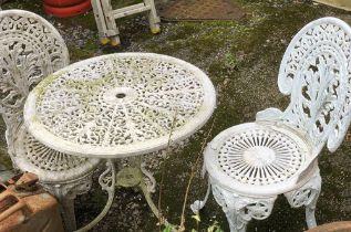A white painted aluminium garden table with matching chairs (one chair af)