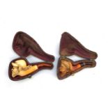 Two 19th century meerschaum pipes in fitted cases, a Turk's head and one other, 7cml and 8.5cml (2)