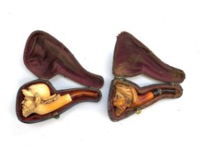 Two 19th century meerschaum pipes in fitted cases, a Turk's head and one other, 7cml and 8.5cml (2)