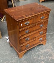 A small bedside chest of drawers, two short over three long, 61x40x72cmH
