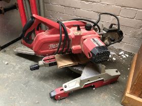 A Milwaukee MS 216 SB mitre saw, with spare blade and stand