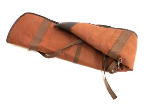 A brown canvas fleece lined gun slip, with shoulder strap