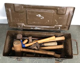 A vintage metal ammo box, containing a number of vintage tools, mostly hammers, wrenches, and