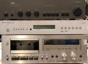 Three hi-fi separates, comprising NAD Series 20 stereo amp 3020A; Pioneer stereo cassette deck CT-