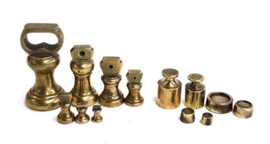 A collection of vintage brass weights, from 1lb downwards