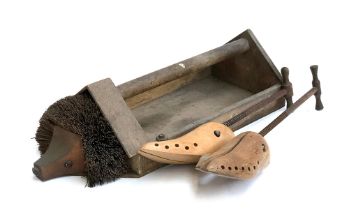 A pair of vintage shoe trees; together with a hedgehog boot scraper