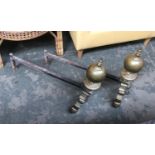 A pair of late 19th century Dutch style brass andirons