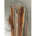 A mixed lot to include antler and hazel walking stick, vintage lacrosse stick, bamboo rods, silver