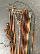 A mixed lot to include antler and hazel walking stick, vintage lacrosse stick, bamboo rods, silver