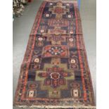A long blue ground rug, 333x115cm