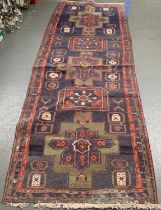 A long blue ground rug, 333x115cm