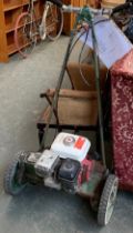 A vintage petrol lawnmower by Lloyd's of Letchworth