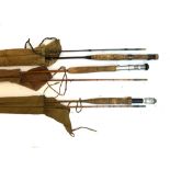 Two split cane two piece rods, one 'The Reda'; together with a black bamboo rod, all in canvas bags,