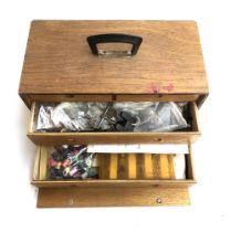 A fly tying box containing vice, capes and other fly tying materials, various wet and dry flies