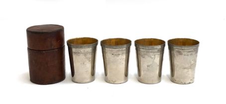 A set of four stirrup cups by Swaine-Briggs, gilt interiors, in leather case