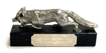 A metal figure of a fox on plinth, snout af, 'Brigadier T.G Williams CBE, Vice President RCB,