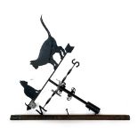 A large wrought iron weathervane with two cats, approx. 85cm wide