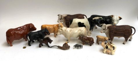 A large collection of Bull figurines, to include Beswick, Saxony, Staffordshire Nelson etc