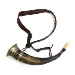 A Continental hunting horn, with leather strap