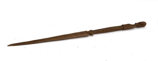 An African carved wood ceremonial blade, the terminal carved with a head of a man, 86.5cm long