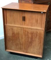 A mid century cocktail cabinet, two tambour doors, over further cupboards, 76x51x100cmH