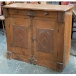 A pine cupboard with single drawer and applied carved oak panels, 100x42x88cmH
