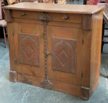 A pine cupboard with single drawer and applied carved oak panels, 100x42x88cmH