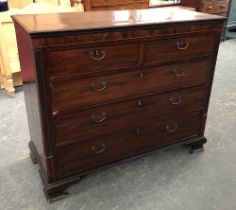 A 19th century mahogany chest of drawers, moulded top with two short and three long drawers, flanked