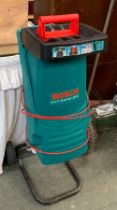 A Flymo electric garden vac; together with a Bosch AFT rapid 200 electric garden shredder