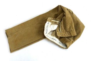 A pair of Barbour buff jumbo cords, 30" inside leg; together with a pair of needle cord olive