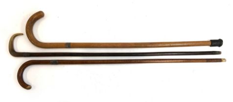 Three silver collared walking sticks, one with horn handle (3)