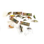 A quantity of fishing lures including Ikonix, Abu Garcia, etc