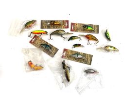 A quantity of fishing lures including Ikonix, Abu Garcia, etc