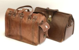 A leather gladstone bag; together with one other