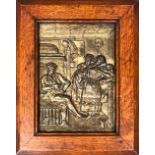A metal relief plaque depicting a tavern scene, 21x15cm, in an oak frame