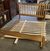 A John Lewis modern pine king sized bed, the headboard with vertical slats, 159cmW, the headboard