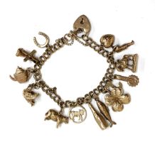A 9ct gold charm bracelet with fourteen 9ct gold charms including donkey, shamrock, swan etc, 28.6g