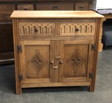 An oak sideboard, two drawers over two cupboard doors, 91x43x85cmH