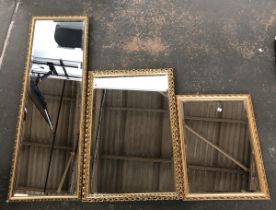 Three 'gilt' framed mirrors, all with bevelled glass, 41x125cm, 58x83cm, 49x65cm (3)