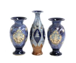 A pair of Royal Doulton vases, by Maud Bowden and Florrie Jones, 27cmH; and one other taller Doulton