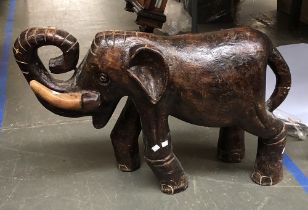 A large carved wooden elephant (tusk AF), 58cmH